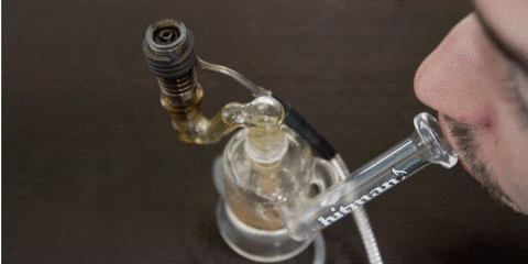 Man taking a CBD dab