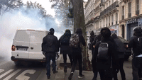 Protester Kicks Tear Gas Canister Back at Police During Paris Political March