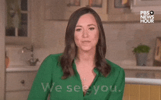 Video gif. Republican Alabama Senator Katie Britt delivers the 2024 Republican response to Pres. Biden's State of the Union from a beige and mustard yellow kitchen. A wide-eyed Britt blankly stares at the camera, smiles and says "We see you. We hear you. And we stand with you." 