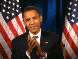 Political gif. President Barack Obama looks at us with an earnest smile and claps like he’s celebrating us. Behind him is an American flag.