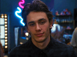 TV gif. James Franco, as Daniel in Freaks and Geeks, nods and smiles widely as a caricature.