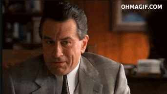 Celebrity gif. Robert De Niro tilts his head and smiles, pointing and shaking his finger at us as if to say, “I see what you did there.”