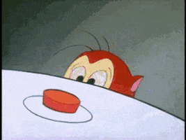 Cartoon gif. Stimpy from The Ren and Stimpy Show drools while looking at a red button. He pushes the red button so hard he jumps in the air.