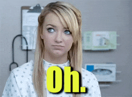 Video gif. A woman in a hospital gown pouts and leans back, saying, "Oh," in disappointment.