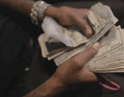 Video gif. Somebody's hands shuffle through a thick stack of 100 dollar bills while a blingy bracelet adorns their wrist.