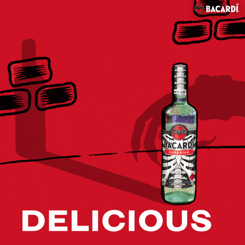 Sponsored gif. A Halloween-themed bottle of Bacardi against a red backdrop. The shadow of a monstrous hand reaches toward the Bacardi. Text reads "DELICIOUS." 