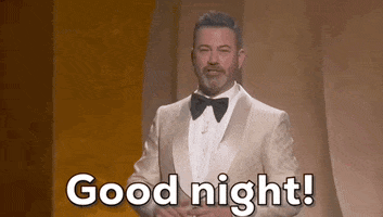 Oscars 2024 GIF. Jimmy Kimmel is concluding the Oscars and he does a short wave with his hand in the air and bids us, "Goodnight!"