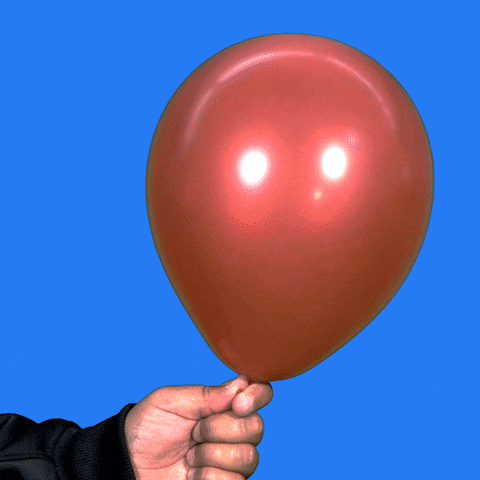 Video gif. A person holding a balloon shakes it left and right before popping it. Confetti flies out and the text appears, reading, "Happy Birthday!"