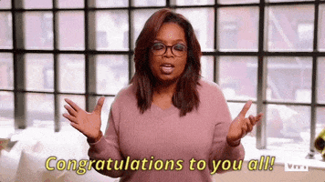 Reality TV gif. Oprah as a guest judge on RuPaul's Drag Race. She opens her arms to emphasize her words and says, "Congratulations to you ALL."