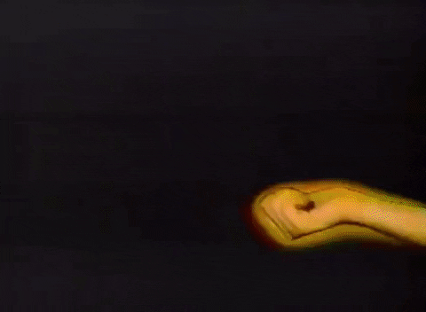 Gif of a hand extending from the right, and a rainbow of different colors emerging from the hand