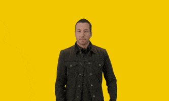 Celebrity gif. Howie Dorough from the Backstreet Boys holds his arms out to the side with a smirk. Text, "Tell Me Why?"