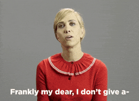 Celebrity gif. Kristin Wiig sits normally and then leans back, giving a sassy look on her face as she says, “Frankly my dear, I don’t give a dayum.”
