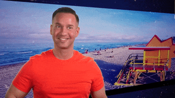 Reality TV gif. Mike from Jersey Shore is being interviewed and he gives a huge grin and shrug of his shoulders.