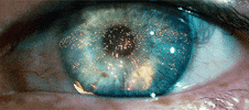 Movie gif. In a close-up of Harrison Ford’s eye as Rick in Blade Runner, we see the reflection of flames.