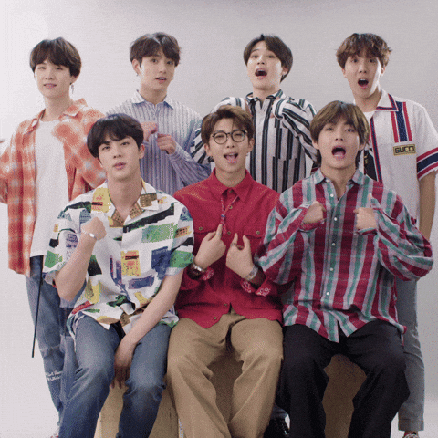 Celebrity gif. Members of BTS gesture in unison, pointing at themselves, making a heart with their hands, and pointing at us, while mouthing "I love you."