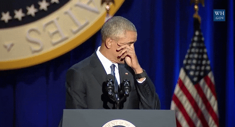President Obama wiping a tear from his eye.