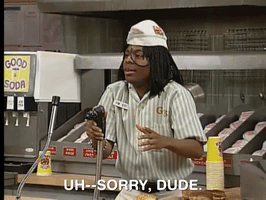 TV gif. Kel Mitchell on All That dressed as his Good Burger character, holds a soda nozzle in his hand. He stands frozen and tense as he stares at a customer. He says, “Uh–Sorry, Dude.”