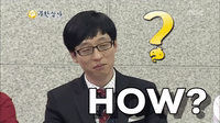 TV gif. Wearing a black suit with a red striped tie, Yoo Jae-suk of Infinite Challenge turns his head to the side. With a playful grin, he asks us: Text, "How?" A yellow question mark with a dot appears next to him.