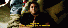 Movie gif. We look straight down at Jonah Hill in This Is The End as he lies on his back in bed, his hands folded. Text, "Dear God, I'd like to pray to you for a second."