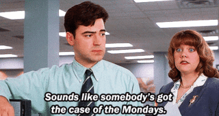 Movie gif. Ron Livingston as Peter in Office Space stands next to a cubicle as a temp, Jennifer Emerson, passing by pretends to whine and says, "Sounds like somebody's got a case of the Mondays," which appears as text.