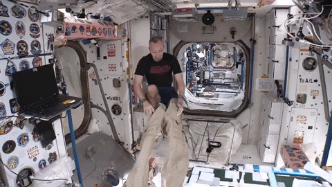astronaut floating in space gif