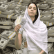 Hijabi woman fanning herself with money.