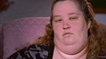 Celebrity gif. Mama June of Here Comes Honey Boo Boo blows a seductive kiss at the camera and smiles.