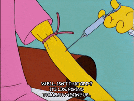 The Simpsons gif. Mr Burns sits in a doctors office as a Doctor pushes a syringe all the way through his forearm. Text, "Well, isn't that odd? It's like poking through meringue."