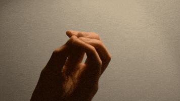 Video gif. Hand with fingers closed and touching in the middle expands to reveal a digitally animated translucent-white geometric webbing connecting the fingers, which waggle and then close again.