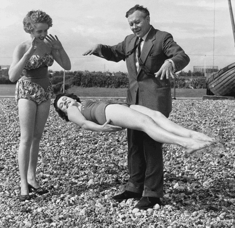 magician floating a woman