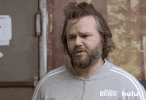 TV gif. Tyler Labine as Kevin in Deadbeat has a furrowed, pleading brow as he raises his hands together in prayer. 