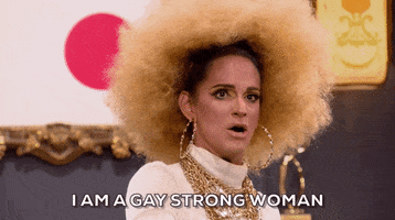 Reality TV gif. Cynthia Lee Fontaine on RuPaul's Drag Race looks forward with conviction and points her finger for emphasis while speaking, "I am a gay strong woman," which appears as text.