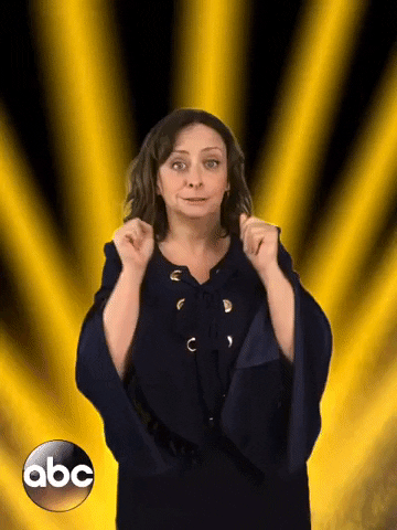 Celebrity gif. Rachel Dratch is cheering us on, waving her fists in the air and whooping. 
