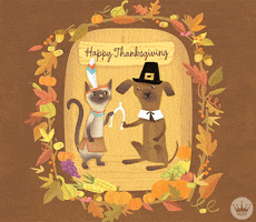 Digital art gif. A cat dressed as a Native American and a dog dressed as a pilgrim hold a wishbone amidst fall foliage. Text, "Happy Thanksgiving!"