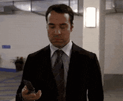 TV gif. Jeremy Piven as Ari Gold in Entourage ends a call and scowls down at his phone before turning and chucking it with full force at the wall. We can feel the satisfaction when it hits the wall and breaks.