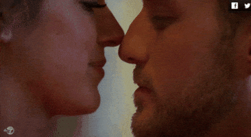 Reality TV gif. The Bachelorette Jojo Fletcher and Chase share an intimate french kiss.