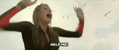 Movie gif. Blake Lively as Nancy in The Shallows, cups her hands around her mouth and yells “HELP ME!” 