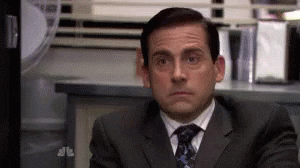 The Office gif. Steve Carell as Michael Scott leans towards us with raised eyebrows, placing his chin on his hands like he's framing an innocent face. 