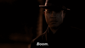 TV gif. Trai Byers as Andre Lyon looks down with a serious gaze in the dark. Steam pours out of his mouth as he says, “Boom.”
