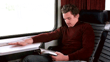 GENEZIZ reading book on the train GIF