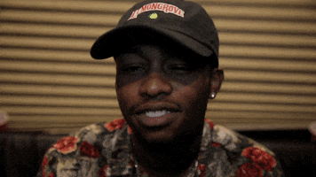 Celebrity gif. Rob $tone is in a recording studio and a smile fills his face. He begins nodding as the smile grows wider.
