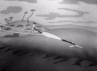 A looping GIF of a person speaking to a brick wall, with the wall’s surface subtly reflecting the speaker’s image back at them.