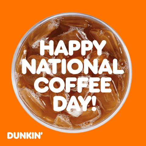 Sponsored gif. Mug of Dunkin’ Donuts iced coffee spins in place. Text reads, “Happy National Coffee Day!”