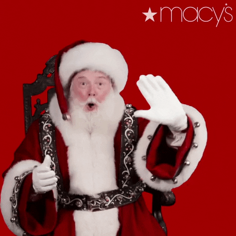 Ad gif. Surprised Santa Claus waves at us against a red background next to the Macy’s logo.