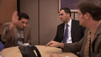 The Office gif. Michael slaps the desk violently and thrusts his hands in presentation, exclaiming with outrage "Thank you!"