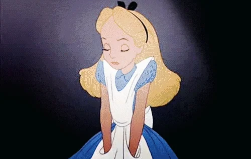 alice in wonderland shrug GIF
