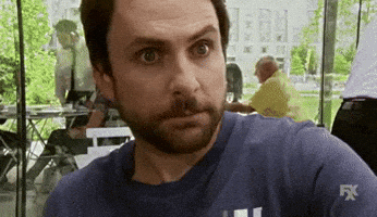 TV gif. Charlie Day as Charlie in It's Always Sunny in Philadelphia rubs his temples as he rolls his eyes as if stressed. 