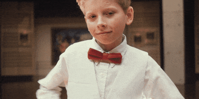 Celebrity gif. Mason Ramsey dabs, tucking his head down into his elbows while his arms point up left and then right.