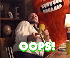 Video gif. Orange monster mascot walks away and a man lists up straight to say, “Oops, I did it again!”