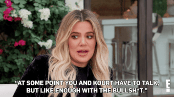 Reality TV gif. Khloe Kardashian on Keeping Up With the Kardashians sits on a white couch outside and says matter-of-factly, "At some point you and Kourt have to talk, but like enough with the bullshit," which appears as text.